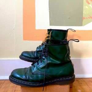 Dr. Martens green leather boots.
